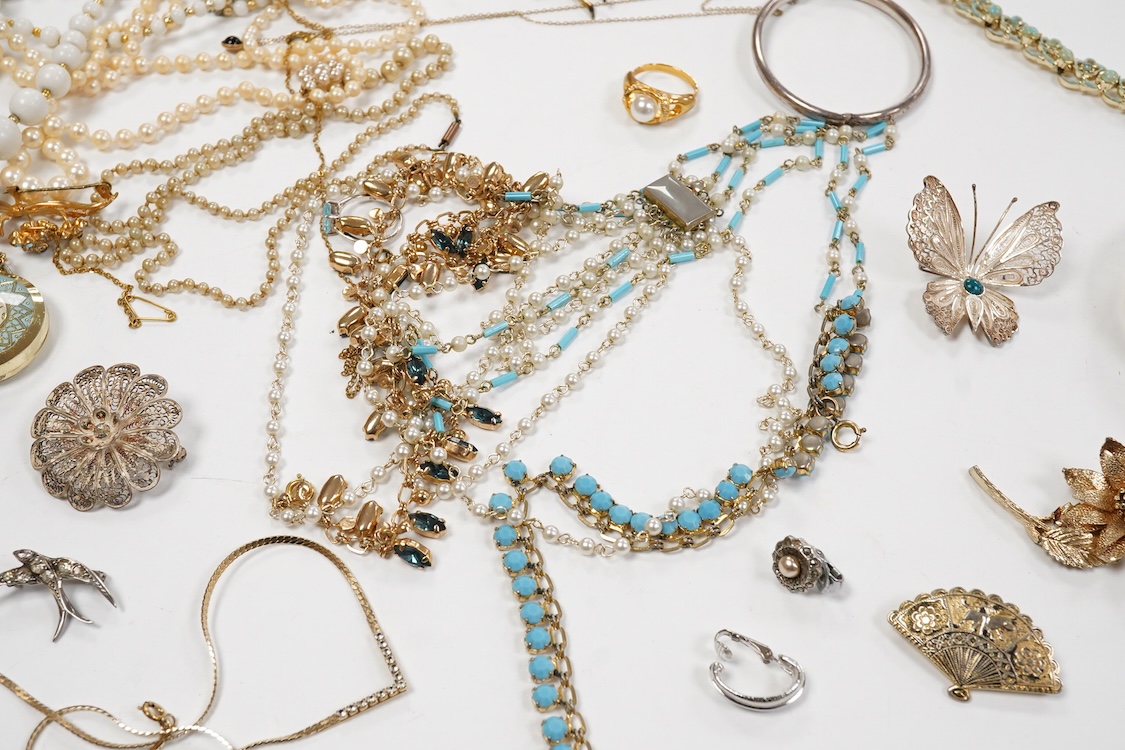 A 9ct and cabochon black onyx set pendant, on a 9ct chain, a 9ct and gem set ring and pair of 9ct and cultured pearl set ear clips, together with other items including costume jewellery, a silver bangle and a silver book